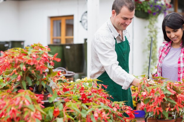 customer-garden-center-worker-discussing-plants_13339-11830.jpg