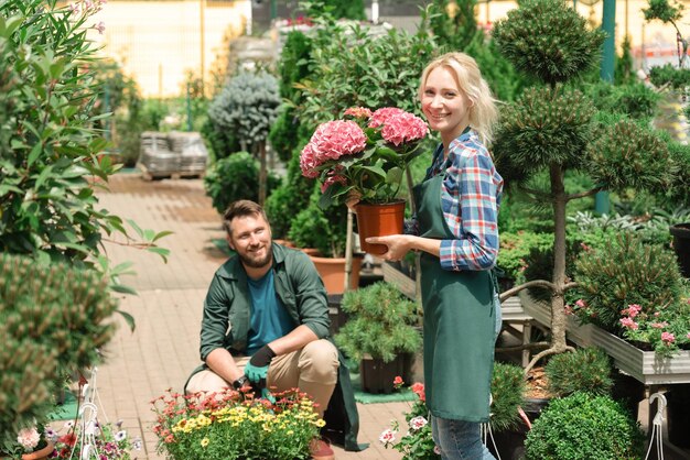 gardeners-working-with-flowers-garden-center_130111-6914.jpg